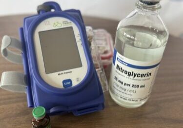 Sapphire IV Infusion pump, with a vial of Norepinephrine and Nitroglycerin